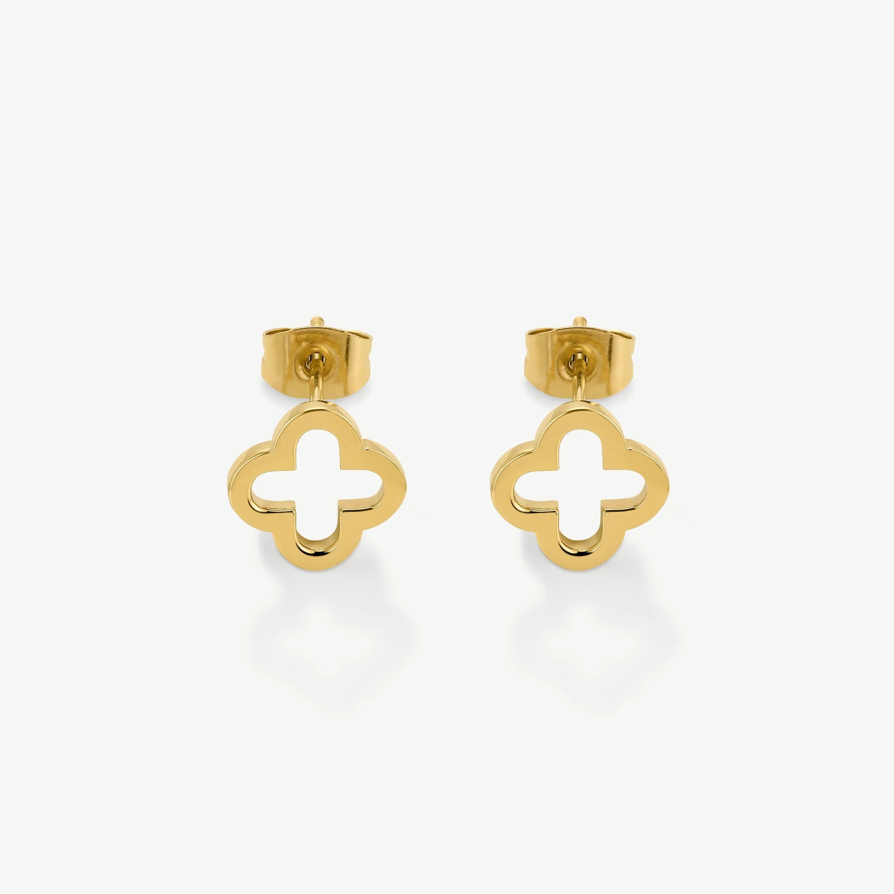 Pair of gold stud earrings with open quatrefoil design on white background