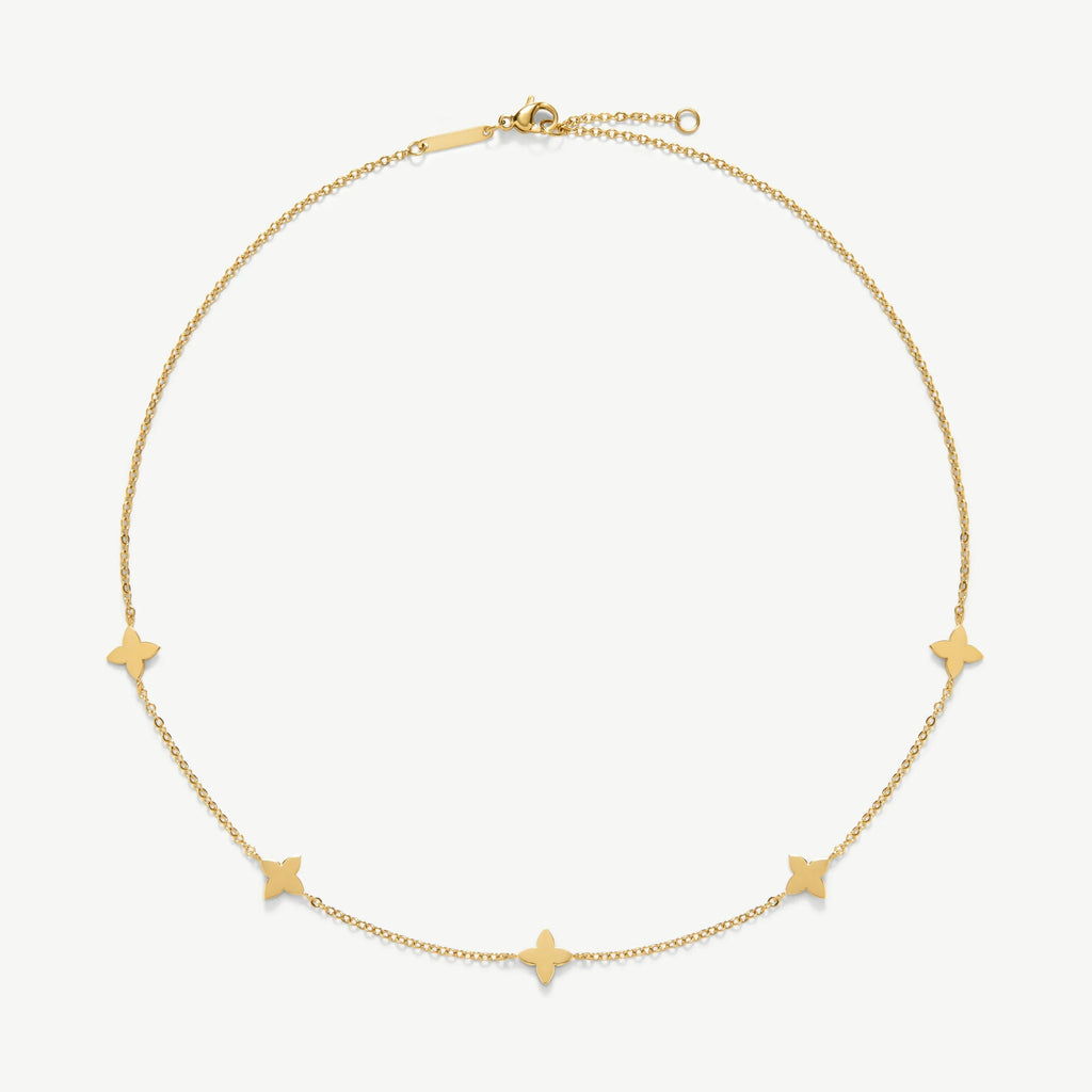 Delicate gold chain necklace with five small butterfly-shaped charms on white background