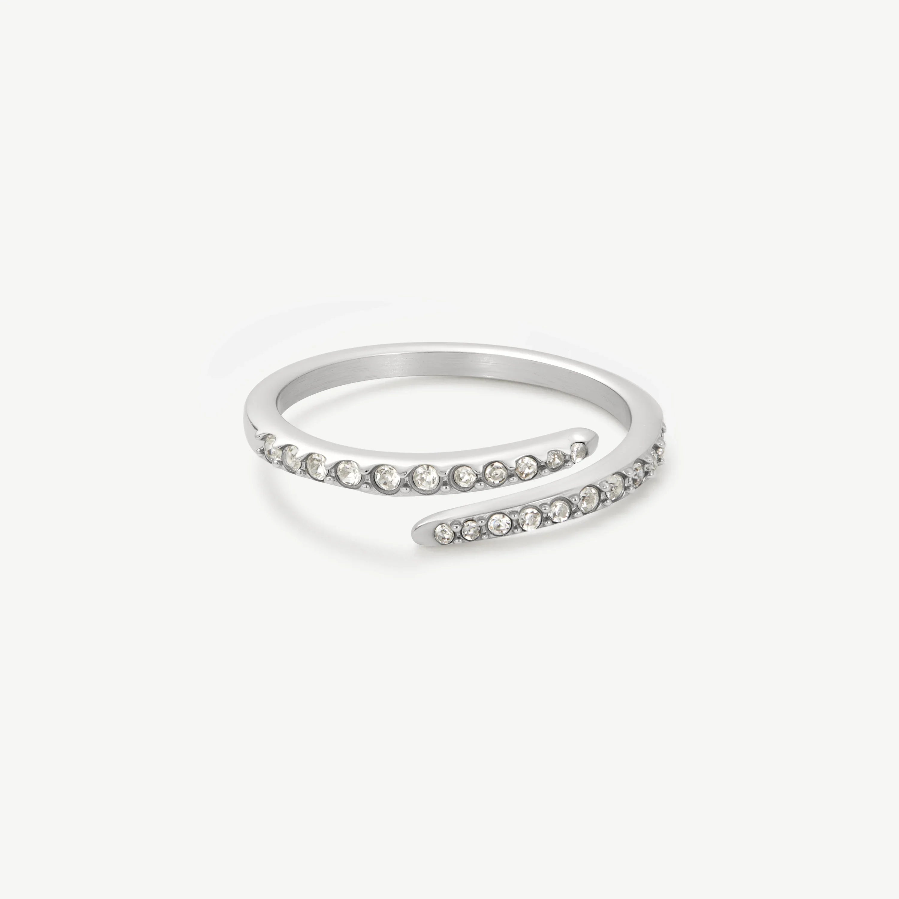 Silver open spiral ring with clear crystal embellishments on white background